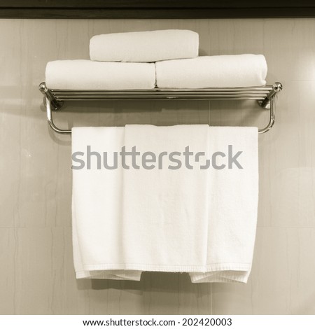 Towel laid on racks in the bathroom, stock photo.
