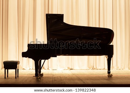 The Piano On The Brown Curtain Background