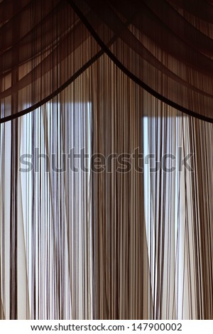 Tne part of brown curtains at home