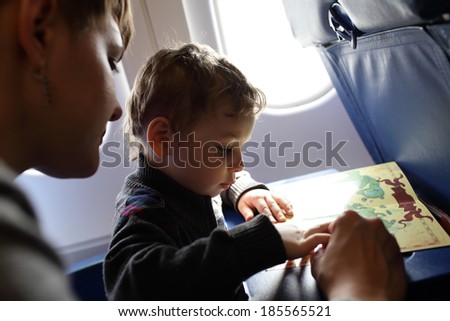 Family playing with a board game on a flight