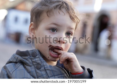 Boy with ice cream on his lips