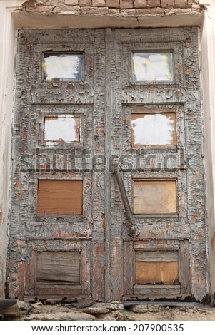 Details of the old ruined wooden door as background