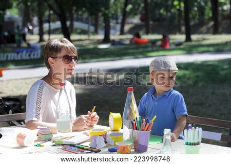Family in the outdoor classroom for drawing