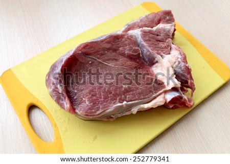 Raw beef blade steak on the cutting board