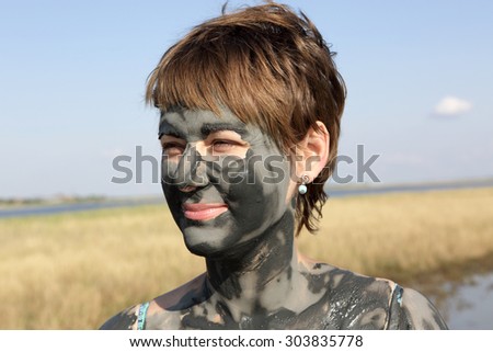 A woman face covered with healthy clay