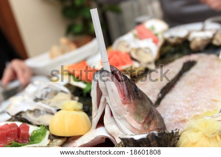 The smoking fish as main dish in restaurant