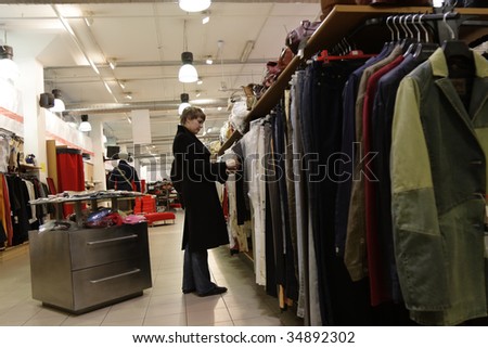 The young woman has shopping - choice clothes