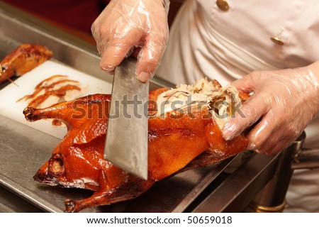 Cutting of Peking Roast Duck. Peking Duck is a famous duck dish from Beijing that has been prepared since the imperial era, and is now considered one of China\'s national foods.