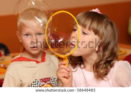 boy blow bubbles