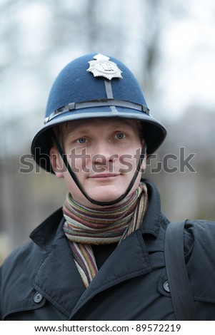 The tourist posing in british police hat