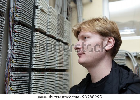 Portrait of telecom engineer on the digital distribution frame background