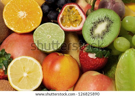 Fruity background of many different fruits