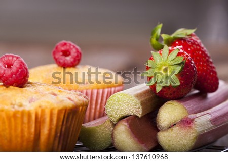 Fruity strawberry rhubarb muffins and fresh fruits