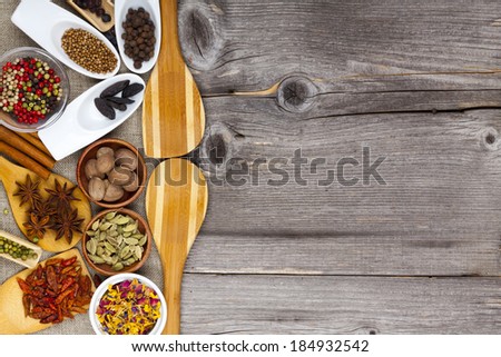 Many different fragrant spices on rustic table