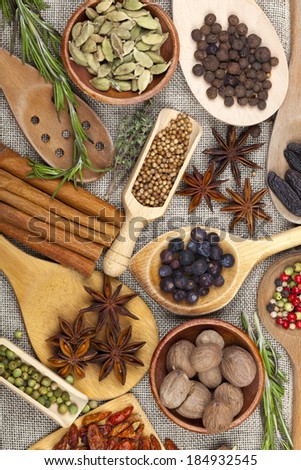 Many fragrant spices in bowls and scoops