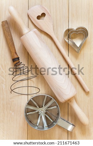 Baking utensils made Ã?Â¢??Ã?Â¢??of wood lying on a wooden table