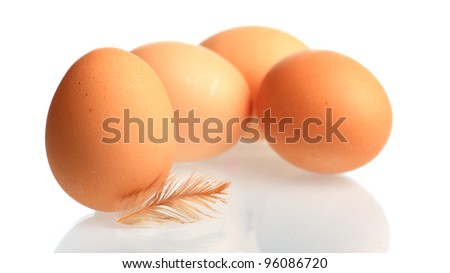 Brown chicken eggs with down feather mirrored