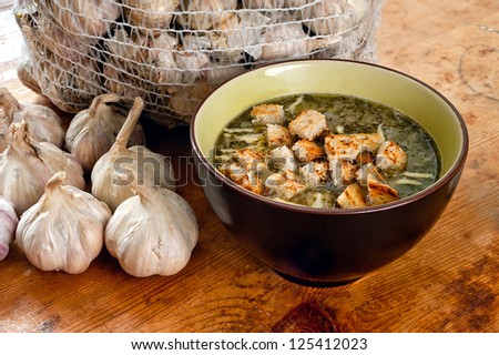 Bowl of a garlic soup with cheese and croutons. Traditional Czech and Slovak dish.