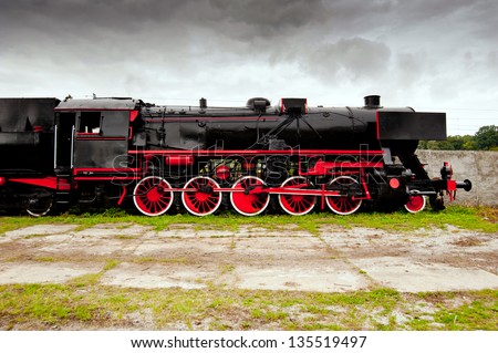 side view of old black, steam locomotive