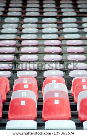 front view of empty rows of stadium seats
