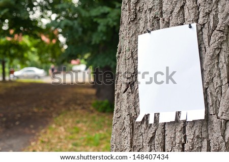 Pinned Blank Vertical Paper Label On A Tree