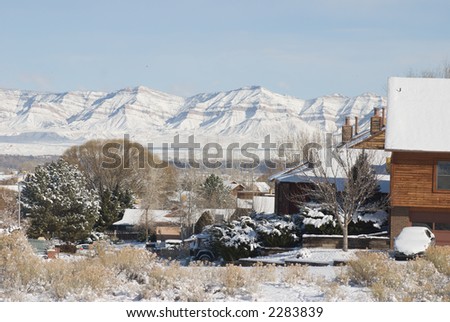View of the Book Cliffs and Grand Junction from the Ridges, a hillside neighborhood, after a snowstorm