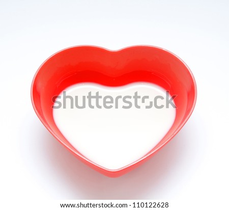 stock-photo-milk-in-red-bowl-shape-heart