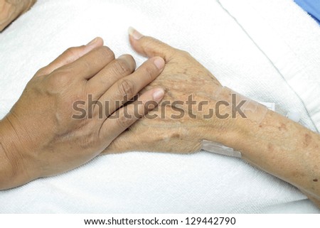 Woman Comforting ,Hand with Old woman