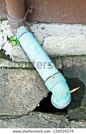 Photo of Sewage pipe for drain water and Garbage into a Concrete drain.