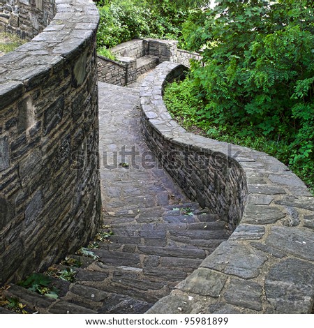 winding stone staircase and wall