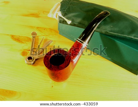 Smocking pipe set 1. A set of equipment necessary to smoke pipe. It consist from pipe, bag for the tobacco, tools for maintaining the pipe  an box in everything is keeping.