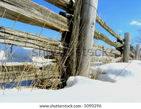 Wooden Fence. Wooden Farm Fence during the sunny winter day after snowstorm.