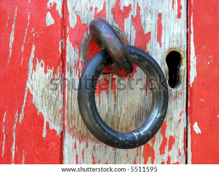 The door ring and lock. The handmade iron door ring on the door of lighthouse.