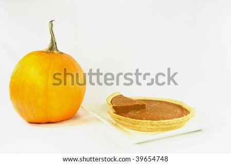 Picture representing frozen pumpkin pie and pumpkin ready to be cooked as pie.