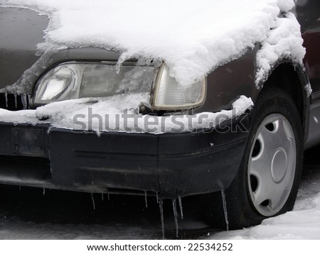 car filled up by snow and ice