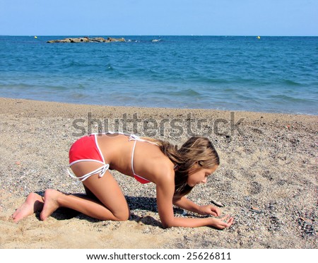 stock photo young girl teenager on a sea beach collects cockleshells
