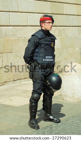 BARCELONA - MARCH 1 : A local police guards house of government during students demonstration against a new education system on March 19, 2009 in Barcelona, Spain.