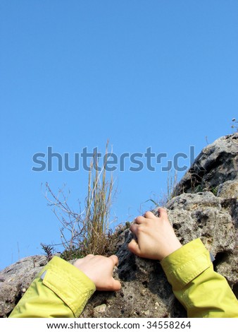female hands of  sportswoman of  rock-climber rising on a rock