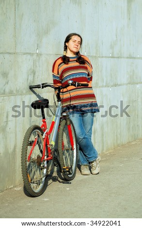 young having a rest woman with a bicycle