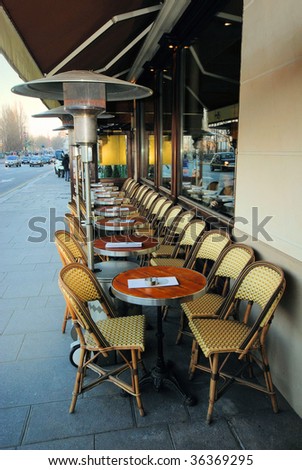 cafe in paris in  street cities with a gas heater