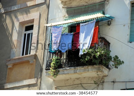 old balcony with drying linen