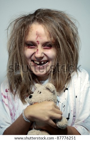 girl in an image of the madwoman of the zombie with a toy for a holiday halloween