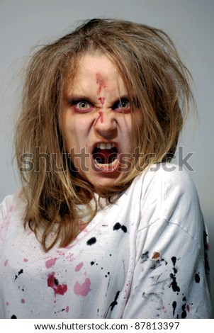 girl in a theatrical image of the furious zombie for holiday halloween