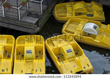 Yellow water bikes in a port