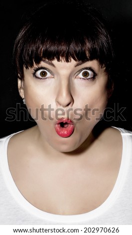 Young caucasian woman making surprised face.