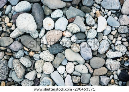 Background of smooth blue stones. Toned effect.