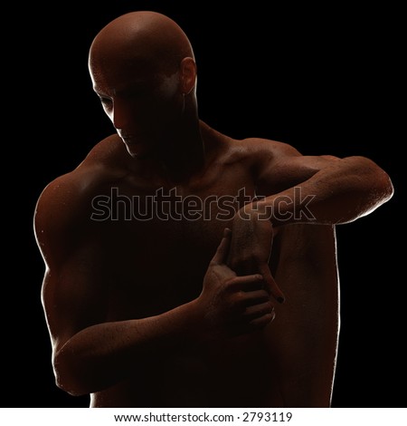 Male figure in repose. High contrast lighting