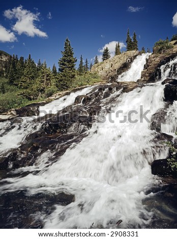 Beautiful cascading waterfall in the Colorado Rocky mountains.