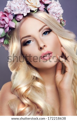 Beautiful lady with a wreath of flowers
