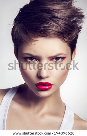 Portrait of beautiful girl with red lips.